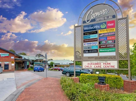 Coonara Shopping Village entry sign displaying all the services available